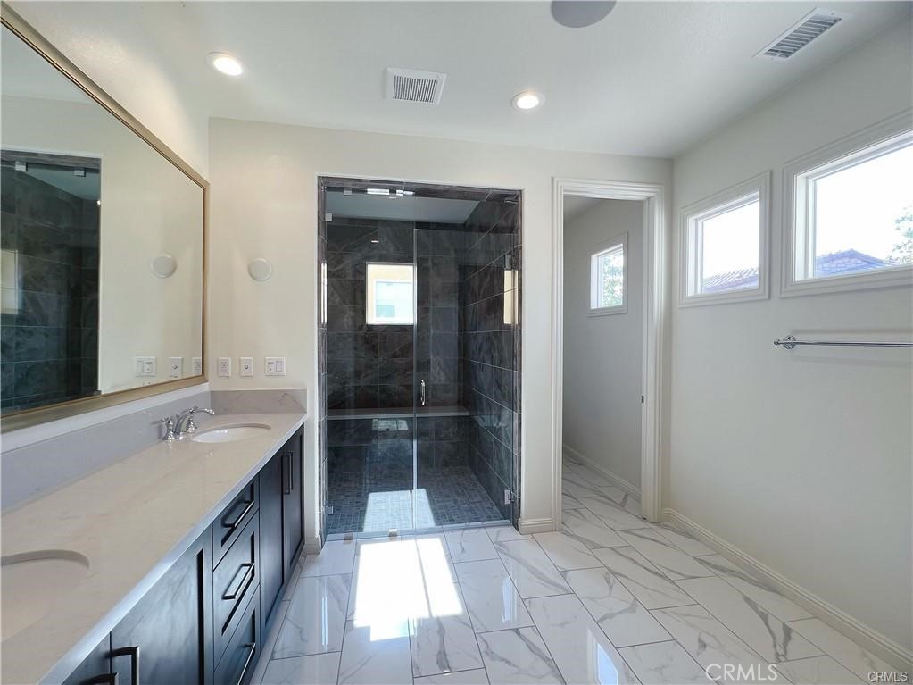 185 Bryce Run Lake Forest, CA 92630 - Photo 21 of 34 a bathroom with a sink a toilet and a large mirror