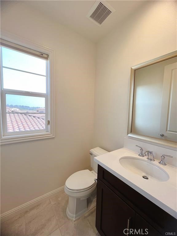 185 Bryce Run Lake Forest, CA 92630 - Photo 32 of 34 a bathroom with a sink and a toilet