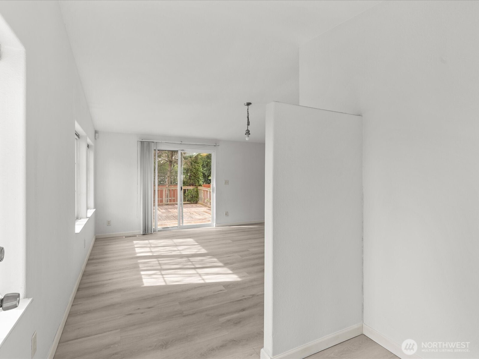 20524 32nd Drive Southeast Bothell, WA 98012 - Photo 12 of 39 a view of an empty room with wooden floor and a window