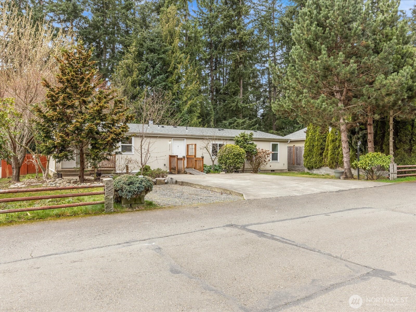 20524 32nd Drive Southeast Bothell, WA 98012 - Photo 13 of 39 a front view of house with a yard and trees all around