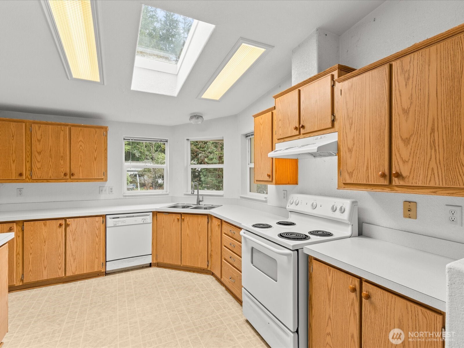 20524 32nd Drive Southeast Bothell, WA 98012 - Photo 17 of 39 a kitchen with stainless steel appliances granite countertop a stove a sink and a microwave