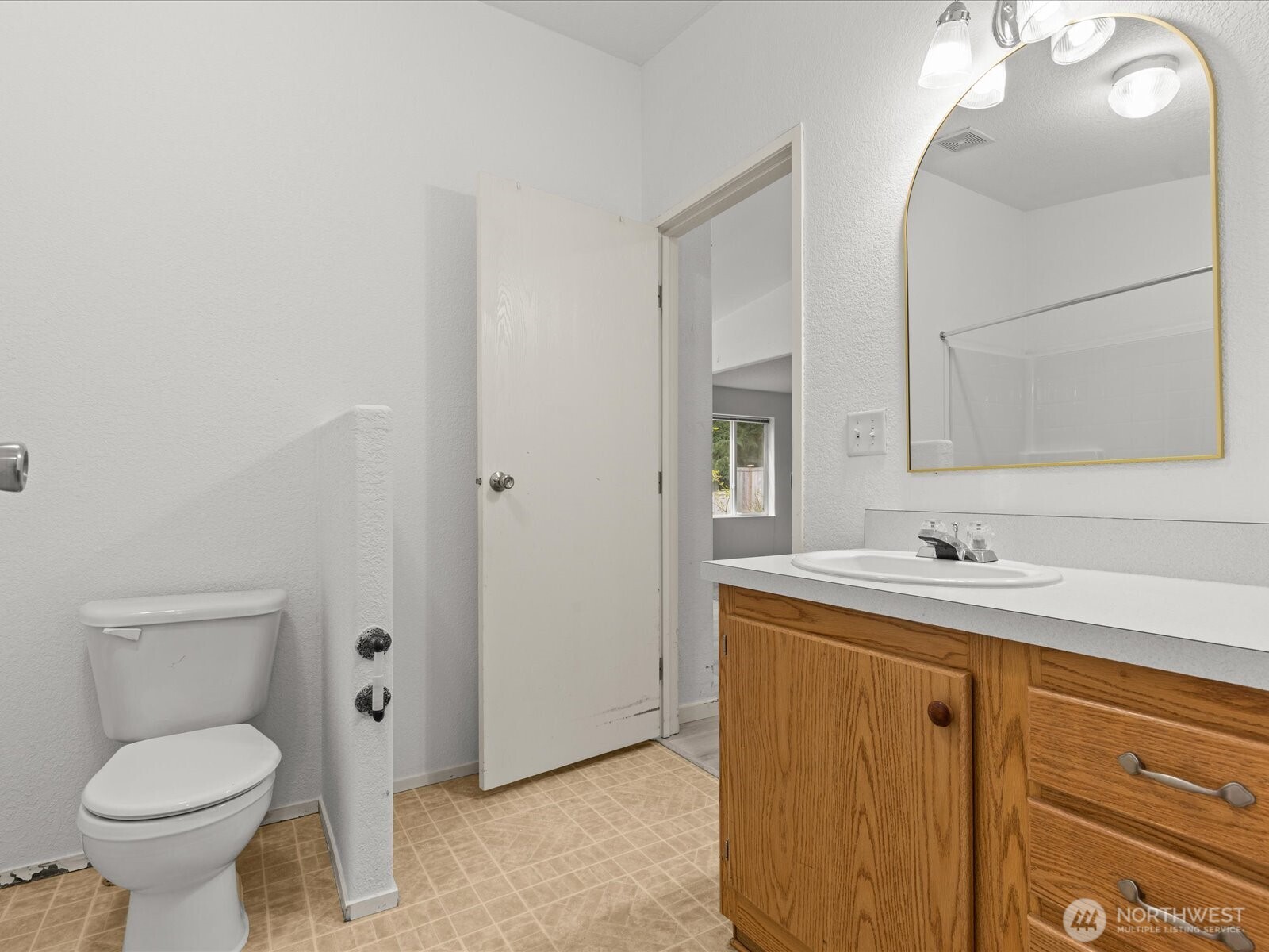 20524 32nd Drive Southeast Bothell, WA 98012 - Photo 26 of 39 a bathroom with a toilet sink and mirror