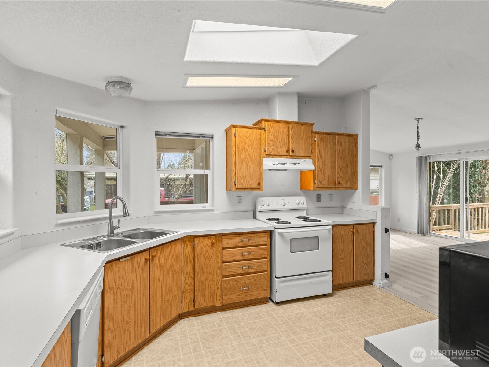 20524 32nd Drive Southeast Bothell, WA 98012 - Photo 29 of 39 a kitchen with stainless steel appliances granite countertop a stove and a sink