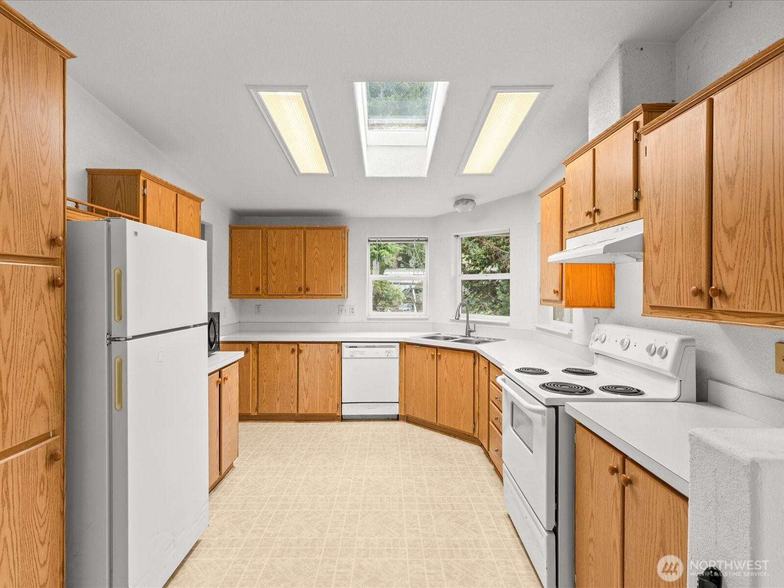 20524 32nd Drive Southeast Bothell, WA 98012 - Photo 3 of 39 a kitchen with stainless steel appliances a refrigerator sink and cabinets