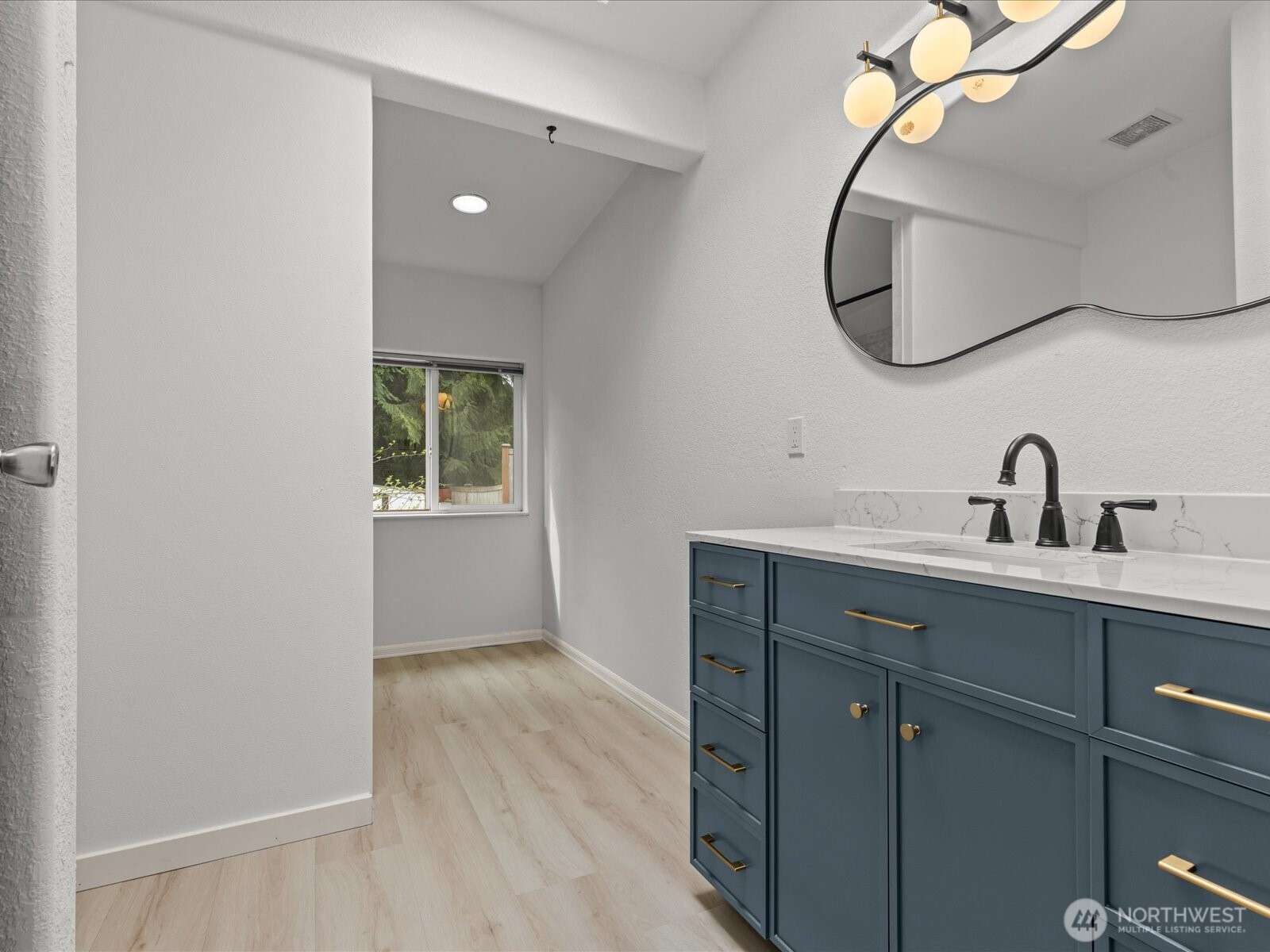 20524 32nd Drive Southeast Bothell, WA 98012 - Photo 5 of 39 a bathroom with a sink and mirror
