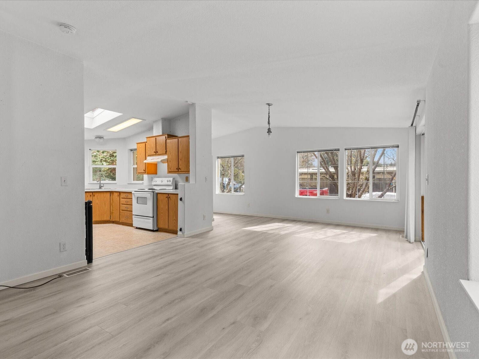 20524 32nd Drive Southeast Bothell, WA 98012 - Photo 7 of 39 a view of an empty room with a window and wooden floor