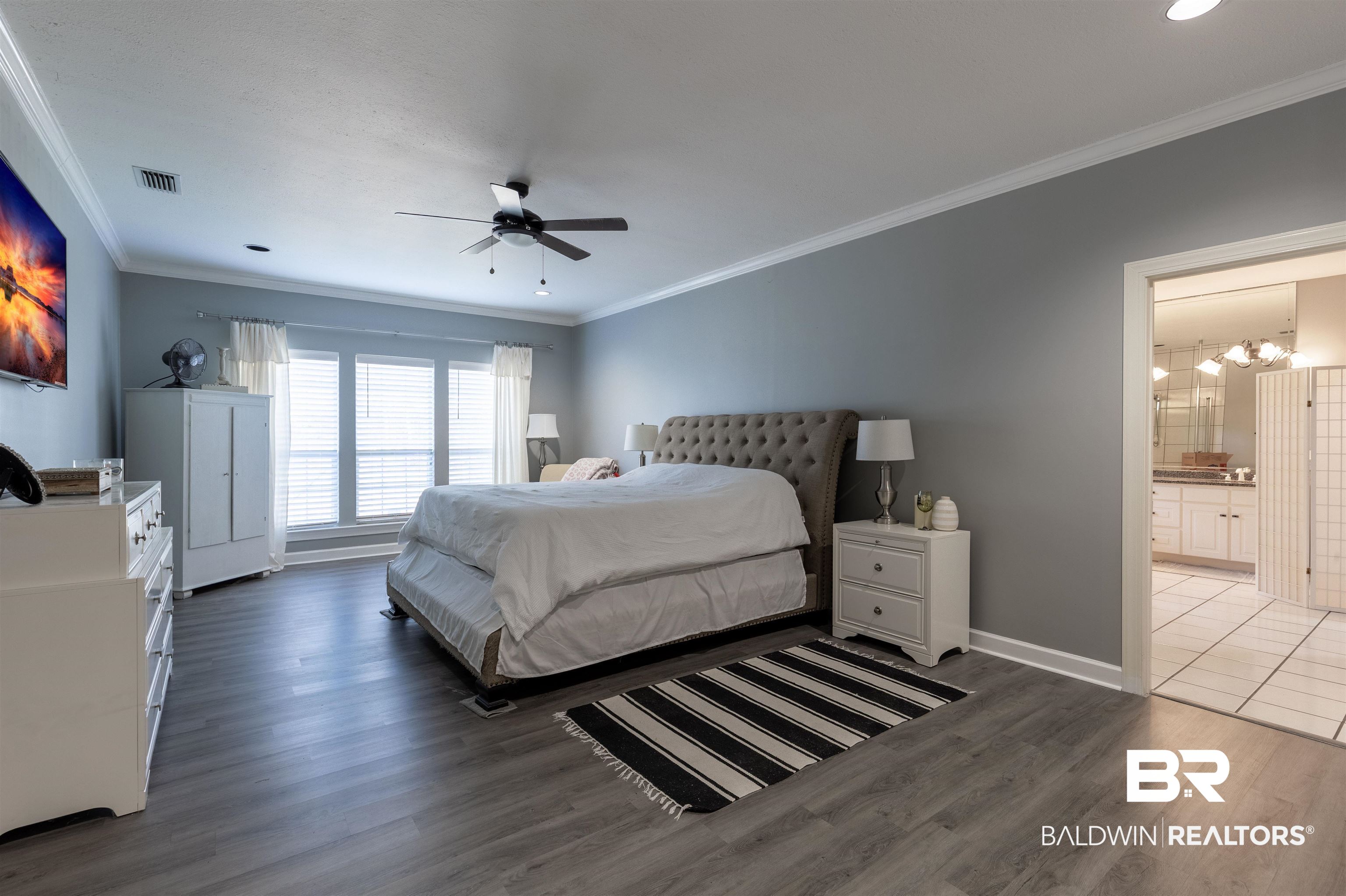 6436 Cherry Ridge Court West Mobile, AL 36695 - Photo 20 of 26 Bedroom featuring wood finished floors, crown molding, baseboards, and visible vents