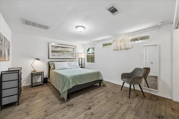 a bedroom with a bed and a view of bathroom