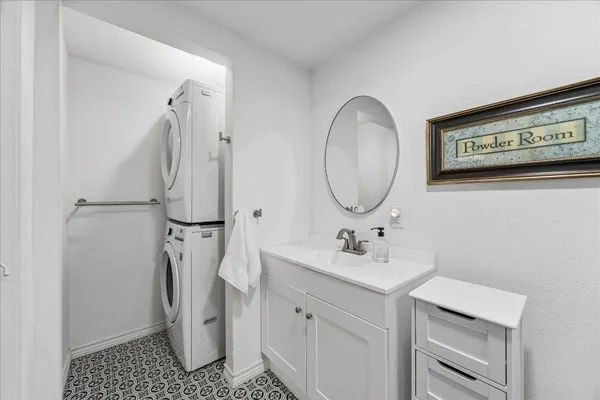 a bathroom with a sink a toilet a shower and a mirror