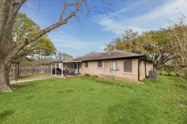 a view of a house with a back yard