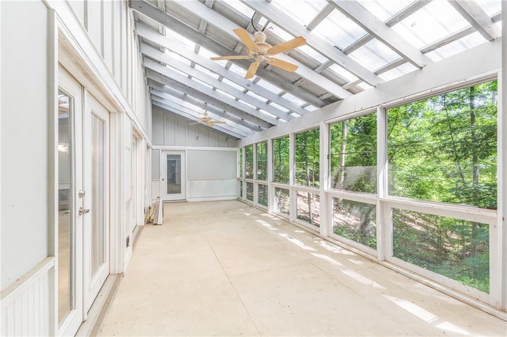 6567 Tahiti Way Flowery Branch, GA 30542 - Photo 21 of 36 a view of a room with a large window