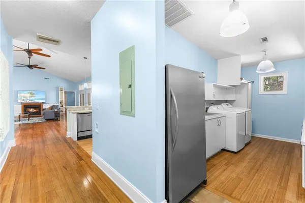 a kitchen with a refrigerator and a stove