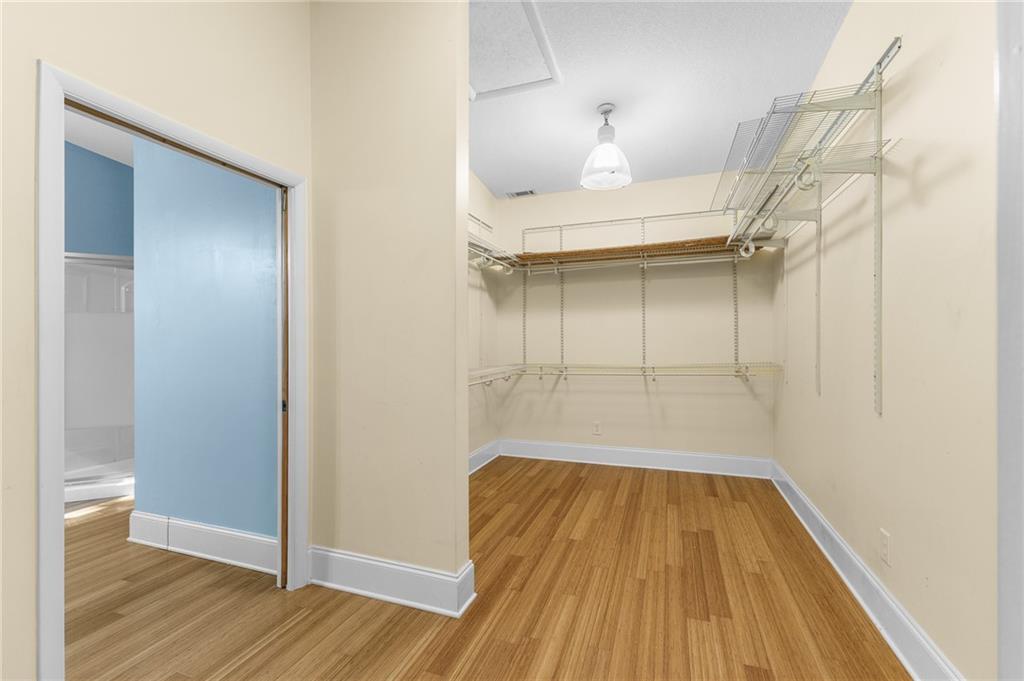 6567 Tahiti Way Flowery Branch, GA 30542 - Photo 31 of 36 a view of a room with wooden floor