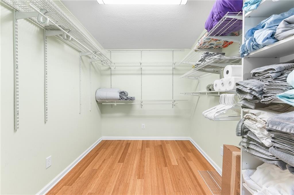 6567 Tahiti Way Flowery Branch, GA 30542 - Photo 33 of 36 a view of a room with racks on the wall