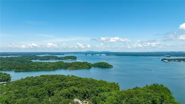 a view of lake with green space