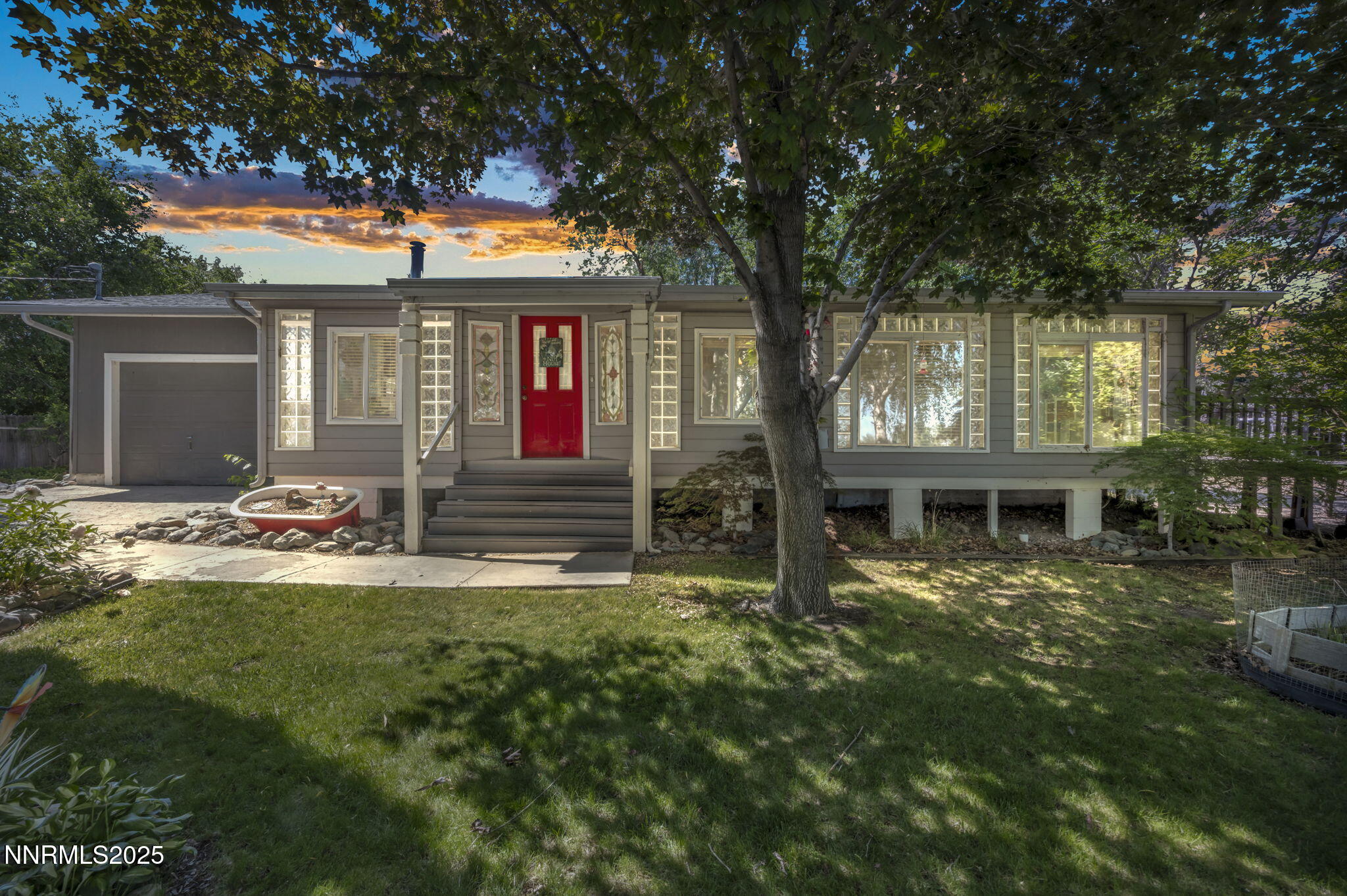 15333 Kivett Lane Reno, NV 89521 - Photo 1 of 38 a front view of a house with a yard