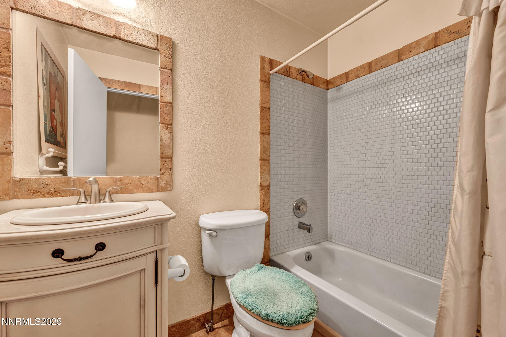 15333 Kivett Lane Reno, NV 89521 - Photo 20 of 38 a bathroom with a toilet a sink and a bathtub