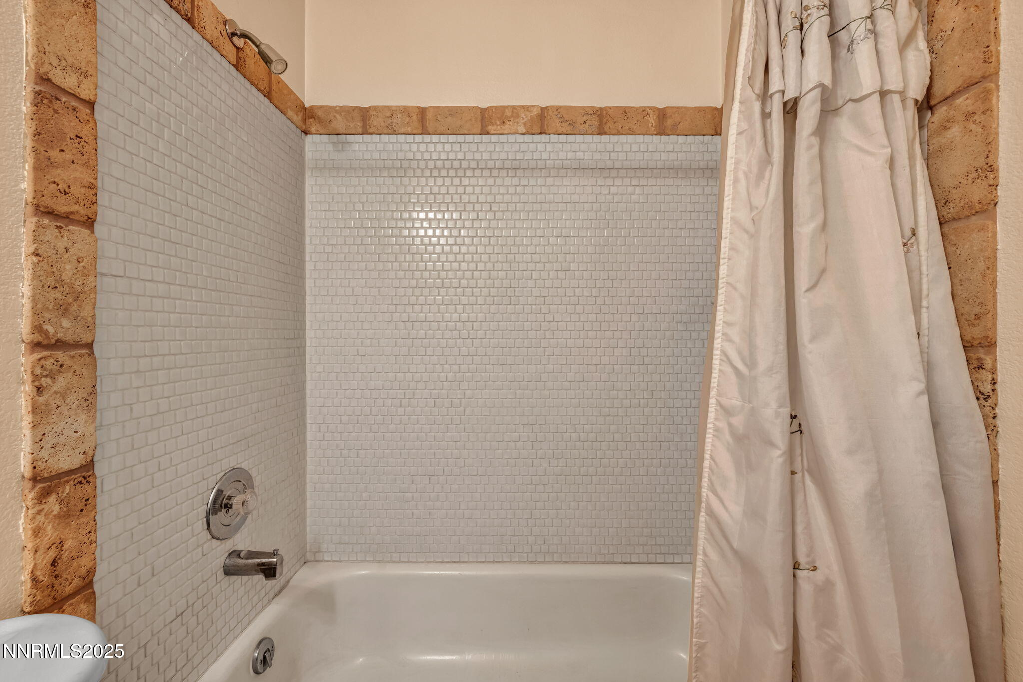15333 Kivett Lane Reno, NV 89521 - Photo 21 of 38 a bathroom with a tub and shower