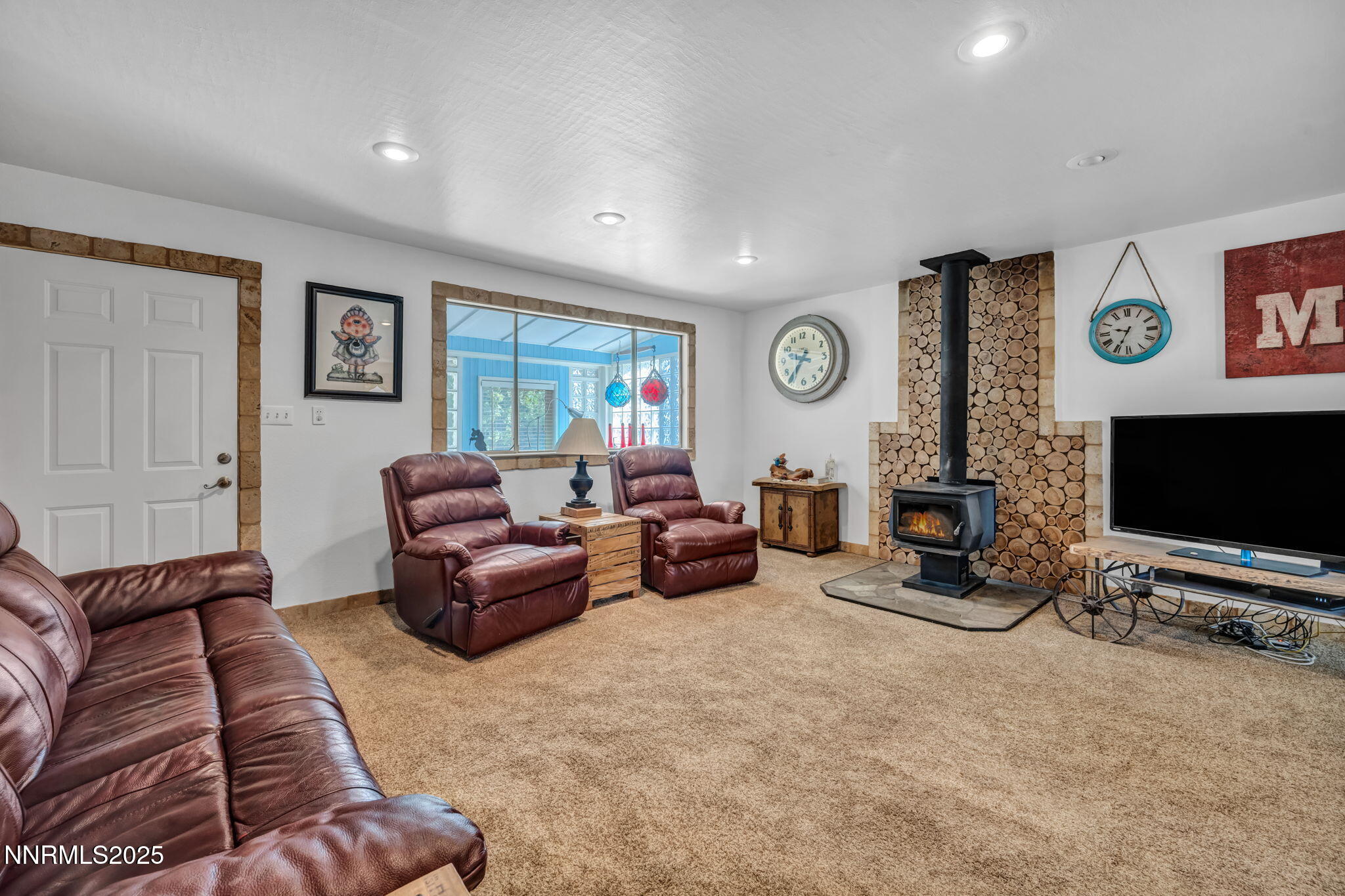 15333 Kivett Lane Reno, NV 89521 - Photo 6 of 38 a living room with furniture and a flat screen tv