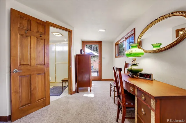 a dining room with furniture and a window