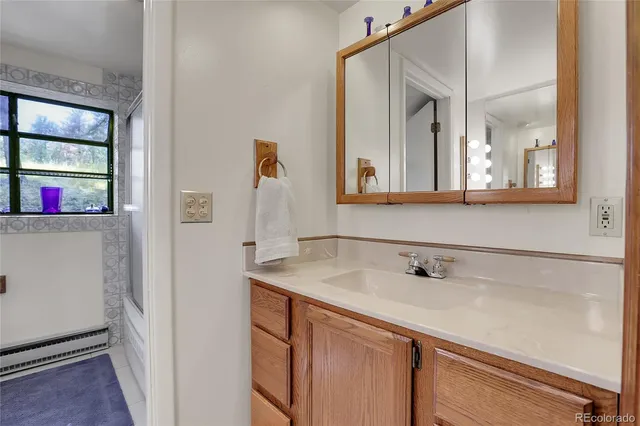 a bathroom with a sink and a mirror