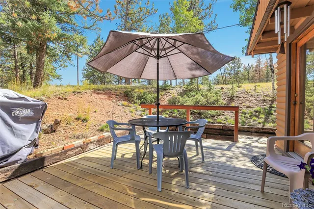 an outdoor space with furniture and umbrella