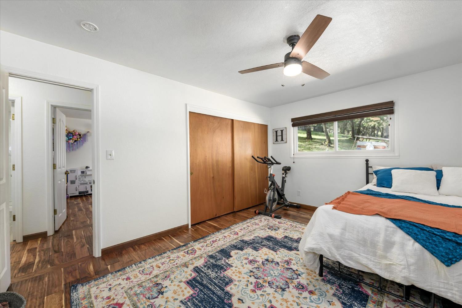 3640 Omo Ranch Road Somerset, CA 95684 - Photo 20 of 57 a bedroom with a bed and a window