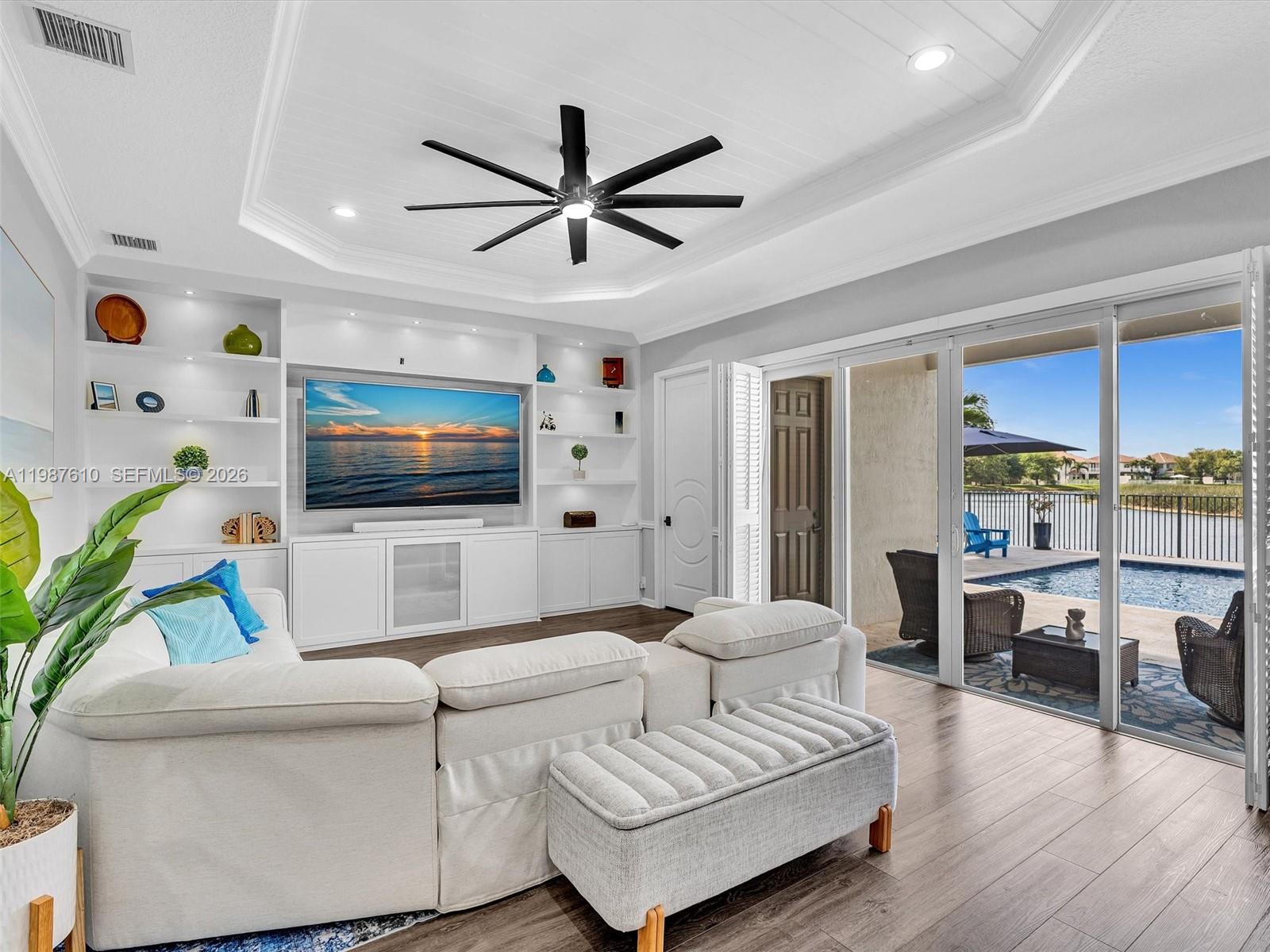 8878 Cobblestone Point Circle Boynton Beach, FL 33472 - Photo 24 of 89 a living room with furniture and a flat screen tv