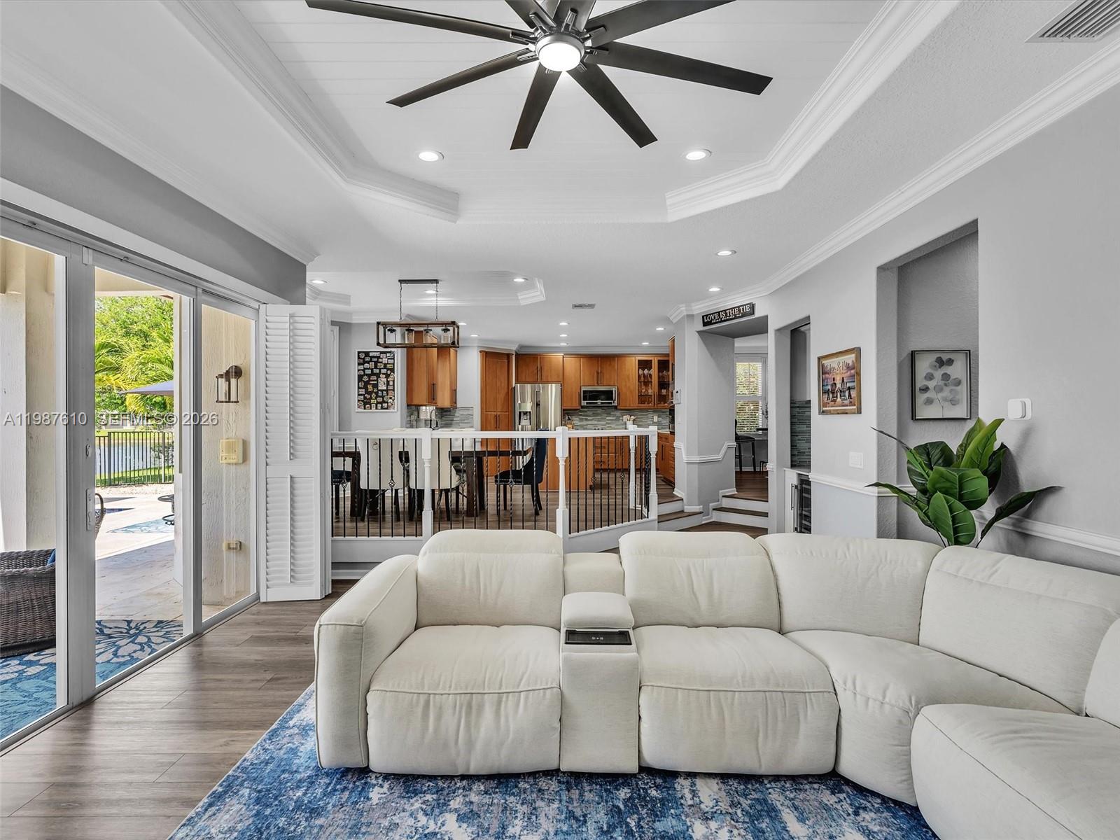 8878 Cobblestone Point Circle Boynton Beach, FL 33472 - Photo 26 of 89 a living room with furniture kitchen view and a large window
