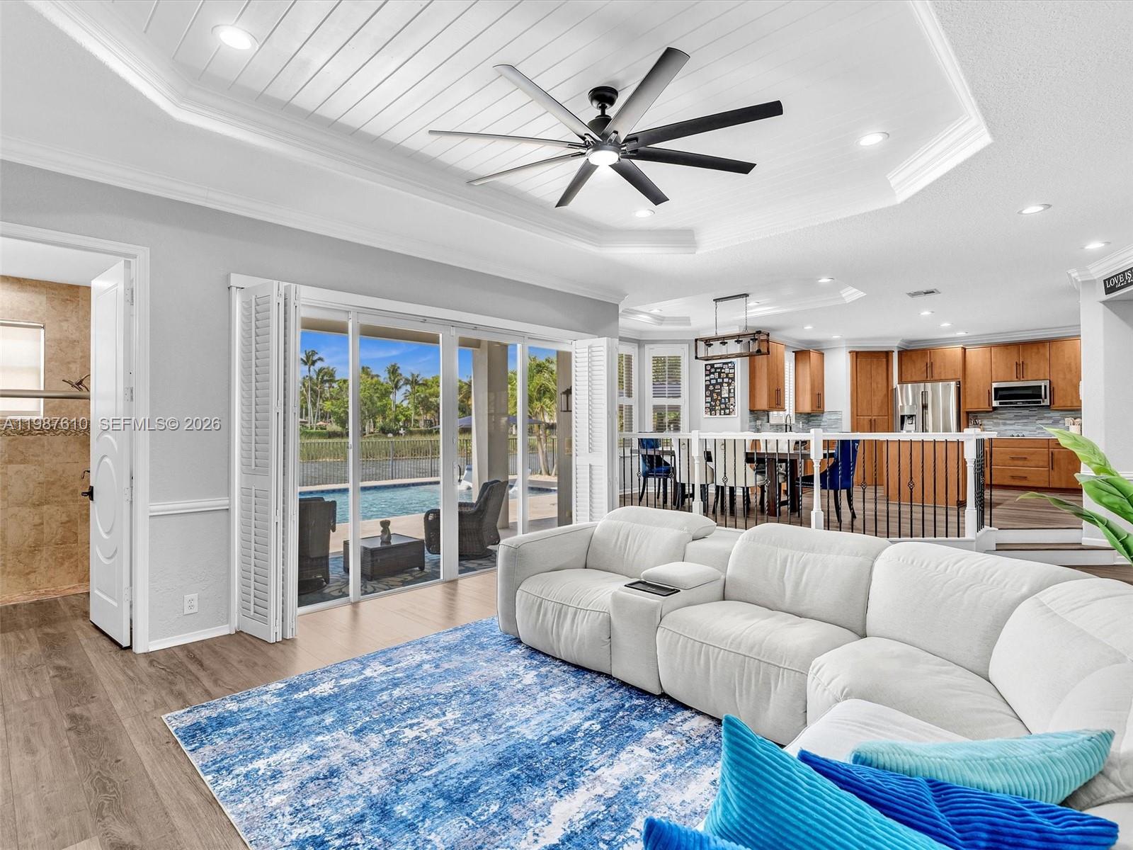 8878 Cobblestone Point Circle Boynton Beach, FL 33472 - Photo 29 of 89 a living room with furniture and a wooden floor