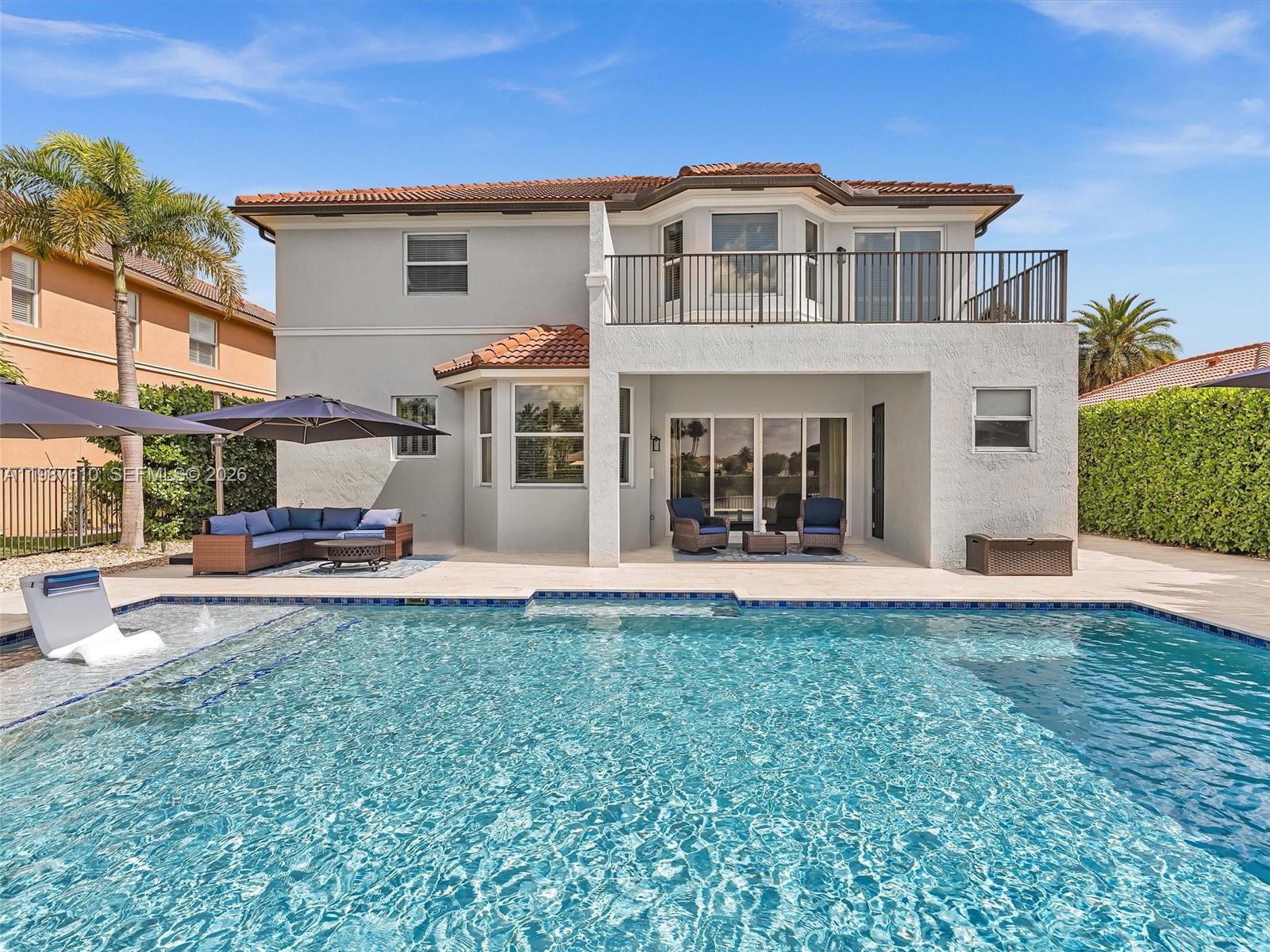 8878 Cobblestone Point Circle Boynton Beach, FL 33472 - Photo 41 of 89 a view of a house with a yard and sitting area