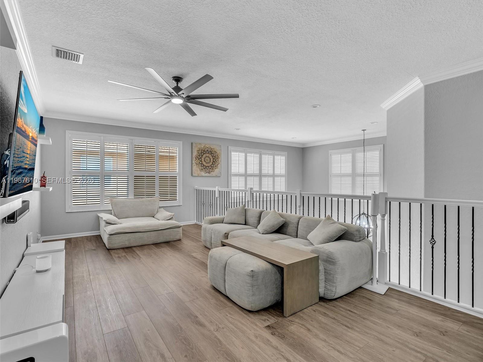 8878 Cobblestone Point Circle Boynton Beach, FL 33472 - Photo 45 of 89 a living room with furniture and a large window