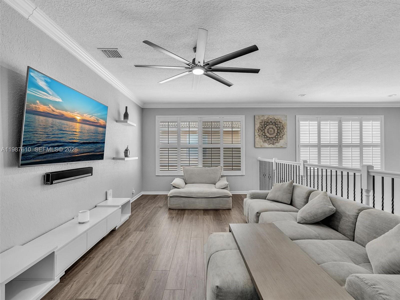 8878 Cobblestone Point Circle Boynton Beach, FL 33472 - Photo 46 of 89 a living room with furniture and a flat screen tv