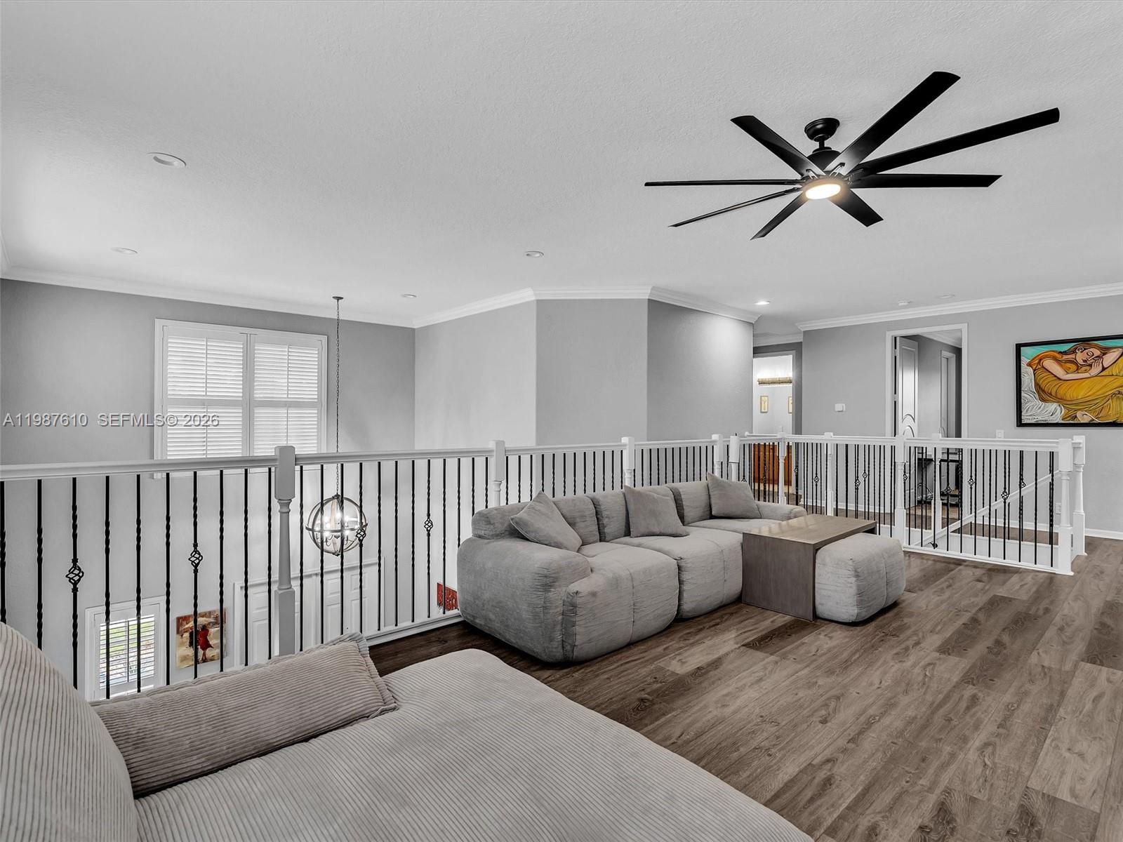 8878 Cobblestone Point Circle Boynton Beach, FL 33472 - Photo 47 of 89 a living room with furniture and a wooden floor