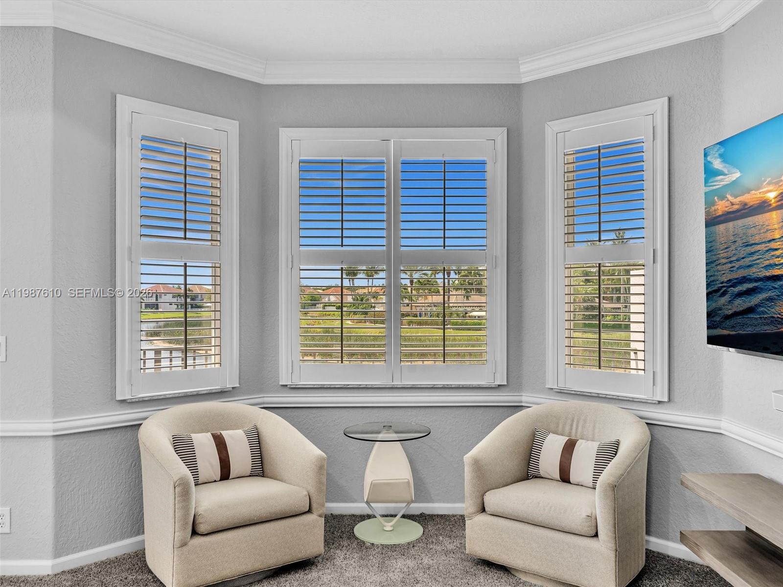 8878 Cobblestone Point Circle Boynton Beach, FL 33472 - Photo 51 of 89 a living room with furniture and a large window