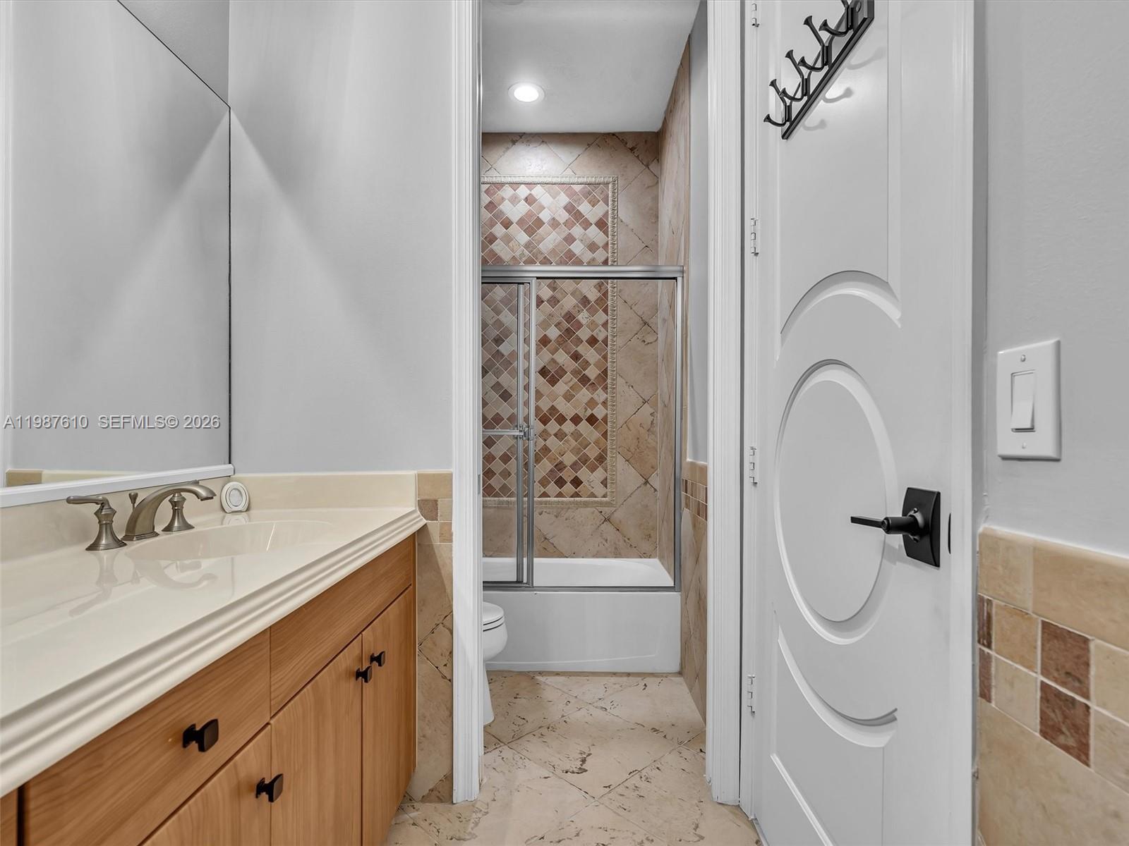 8878 Cobblestone Point Circle Boynton Beach, FL 33472 - Photo 73 of 89 a bathroom with a sink a toilet and shower