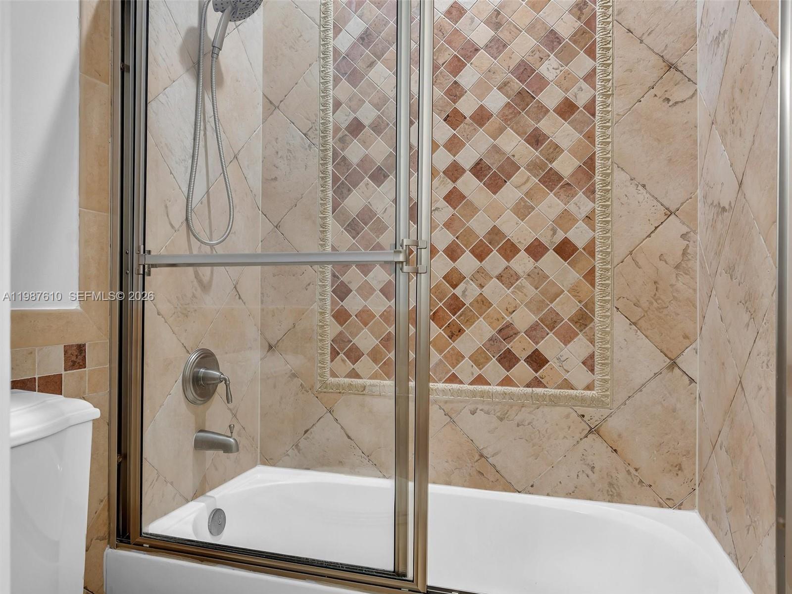 8878 Cobblestone Point Circle Boynton Beach, FL 33472 - Photo 74 of 89 a bathroom with a bathtub and shower