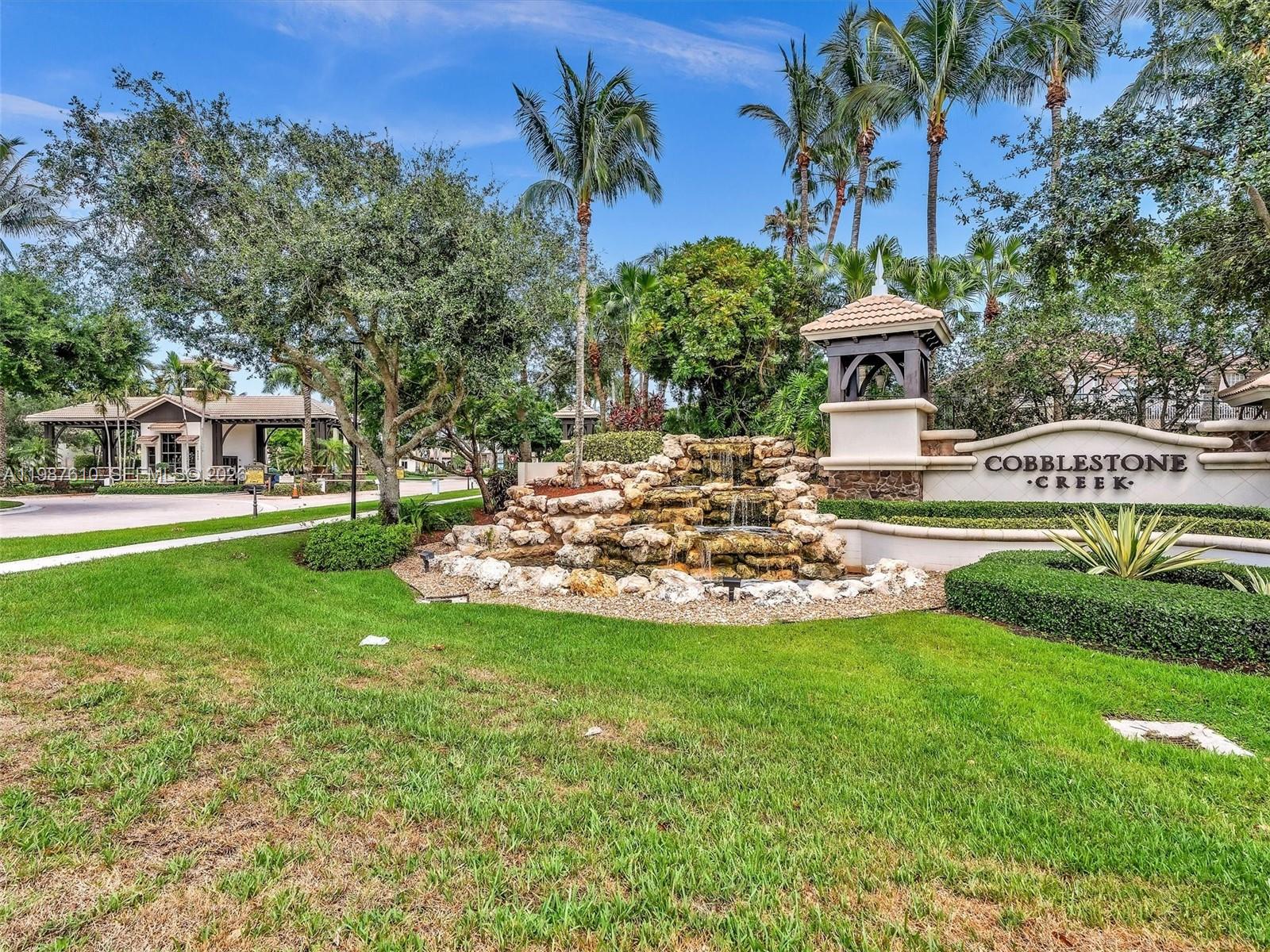 8878 Cobblestone Point Circle Boynton Beach, FL 33472 - Photo 81 of 89 a view of a house with a swimming pool