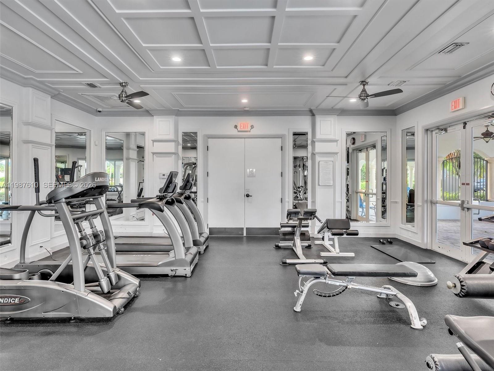 8878 Cobblestone Point Circle Boynton Beach, FL 33472 - Photo 87 of 89 a view of a room with gym equipment