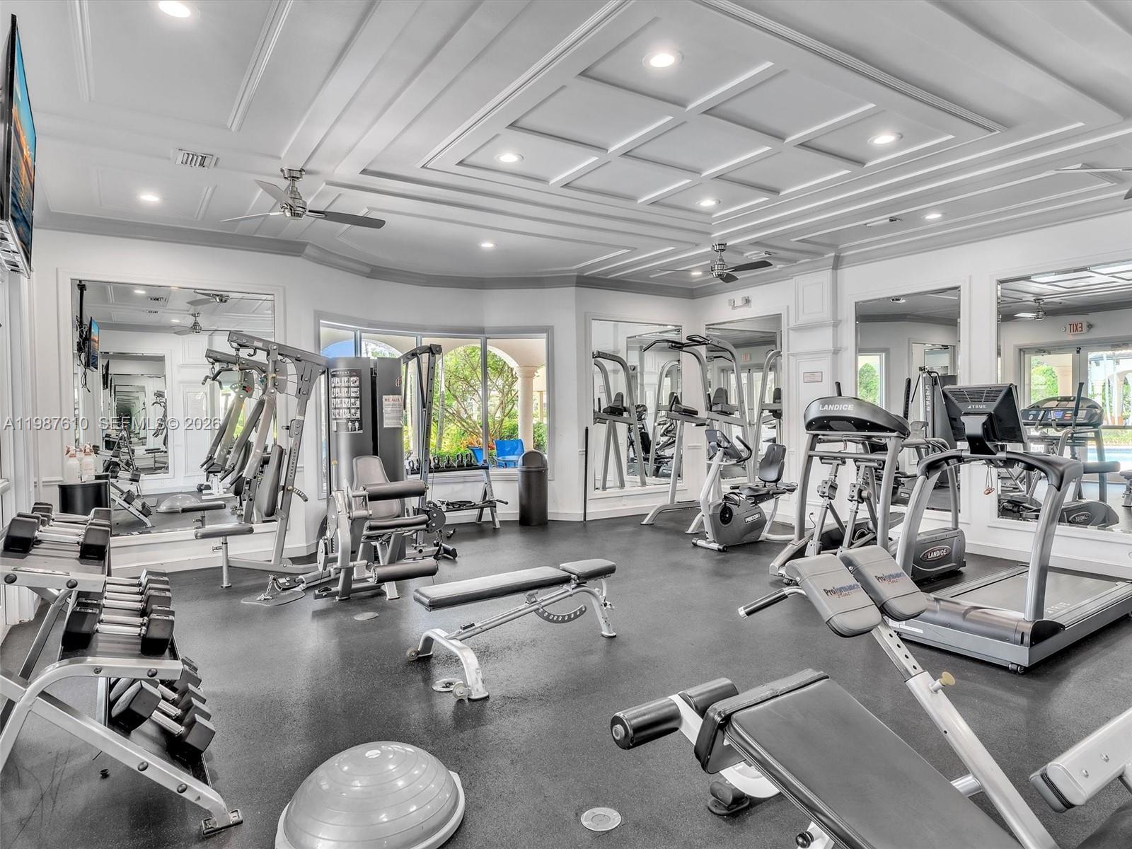 8878 Cobblestone Point Circle Boynton Beach, FL 33472 - Photo 89 of 89 a room with gym equipment and a large window