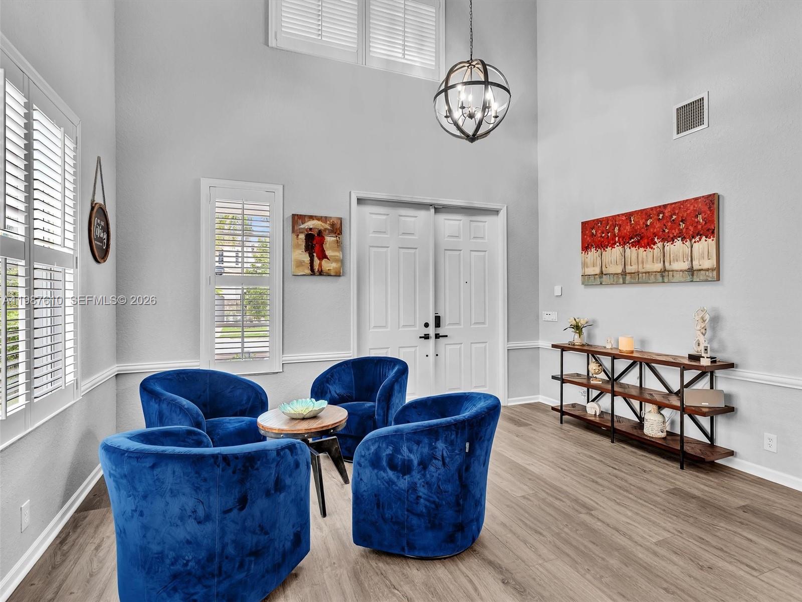 8878 Cobblestone Point Circle Boynton Beach, FL 33472 - Photo 10 of 89 a living room with furniture and a window