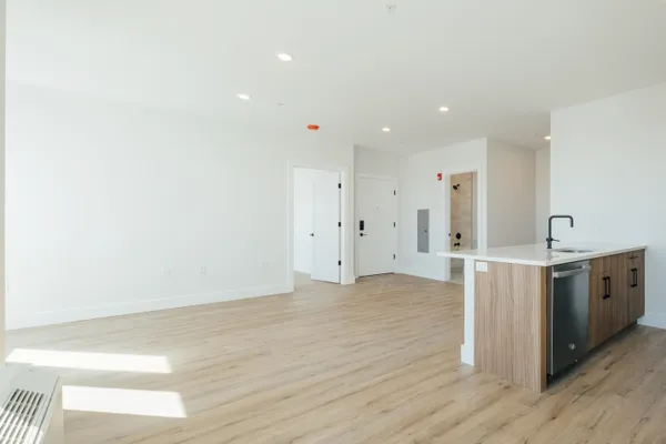 a view of a kitchen with wooden floor