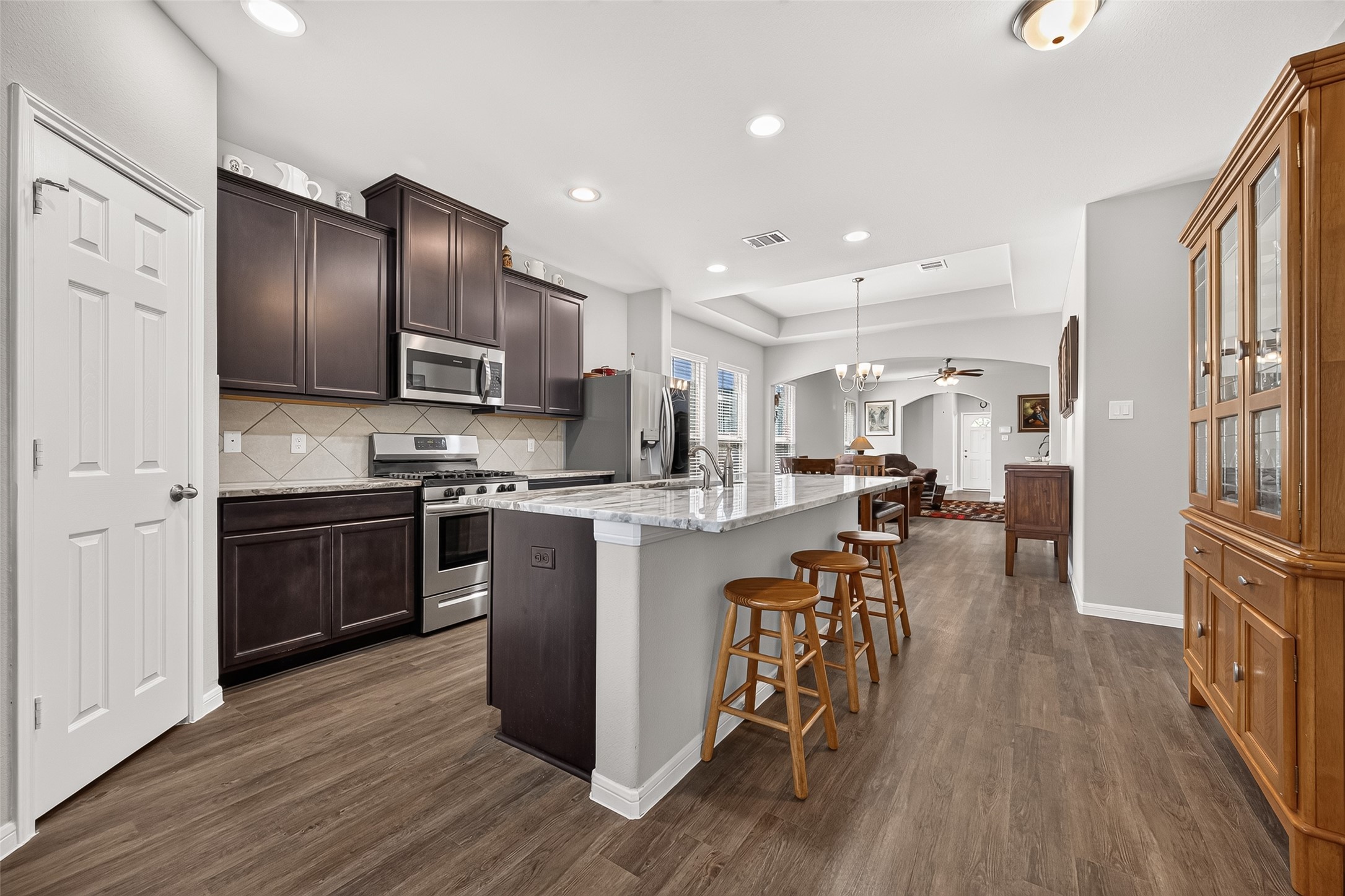 1329 Red Hills Drive Rosharon, TX 77583 - Photo 14 of 27 Look at that sleek island with bar seating.