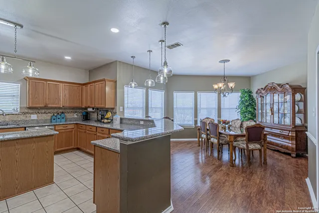 a bathroom with a sink vanity and mirror
