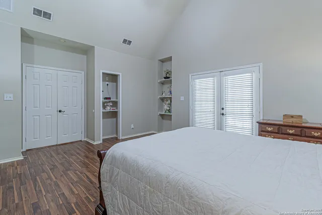 a bed sitting in a room next to a window