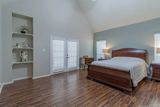 a bed room with a bed and a chandelier