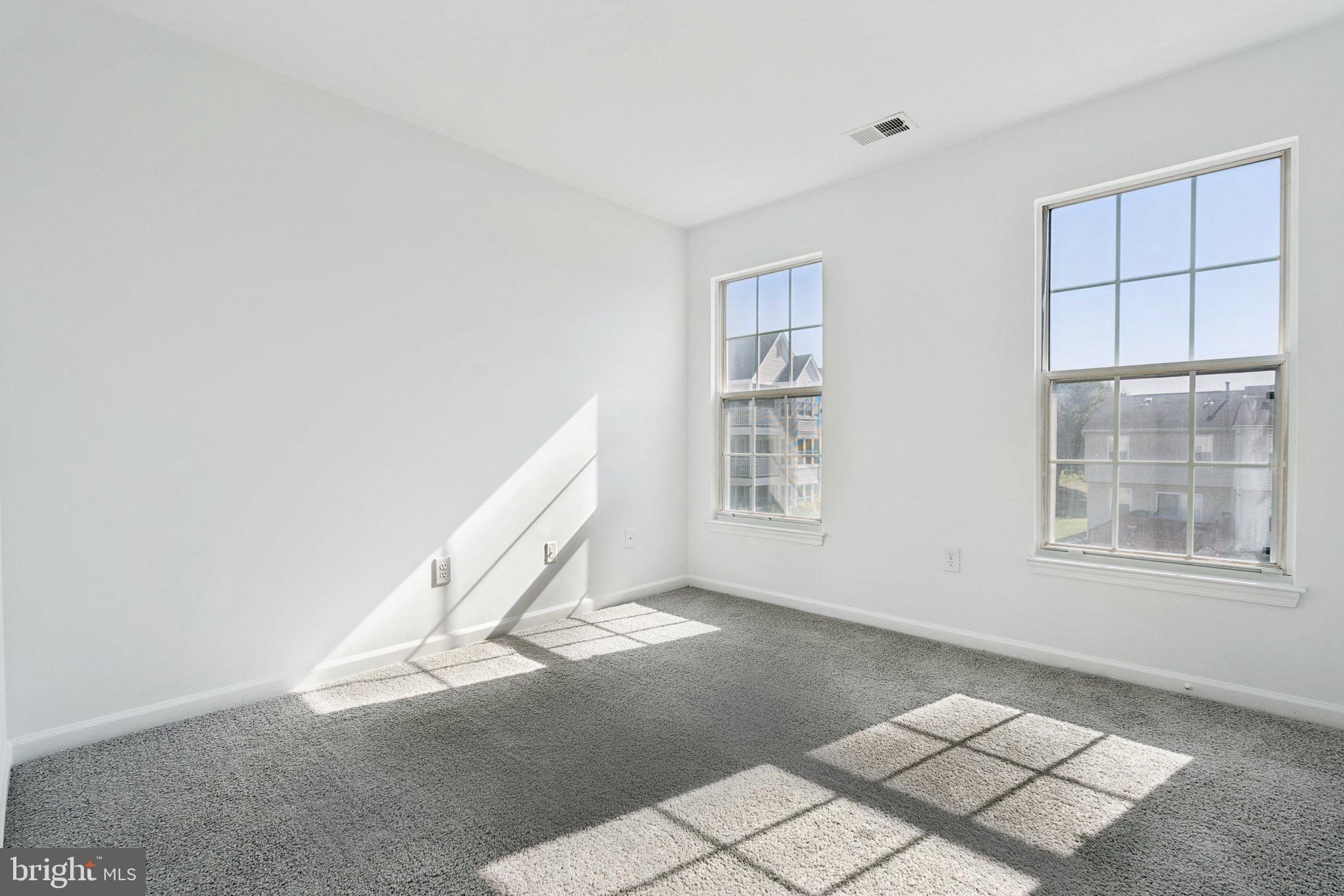 7655 Gladstone Road, Unit 5 Baltimore, MD 21244 - Photo 13 of 25 an empty room with windows