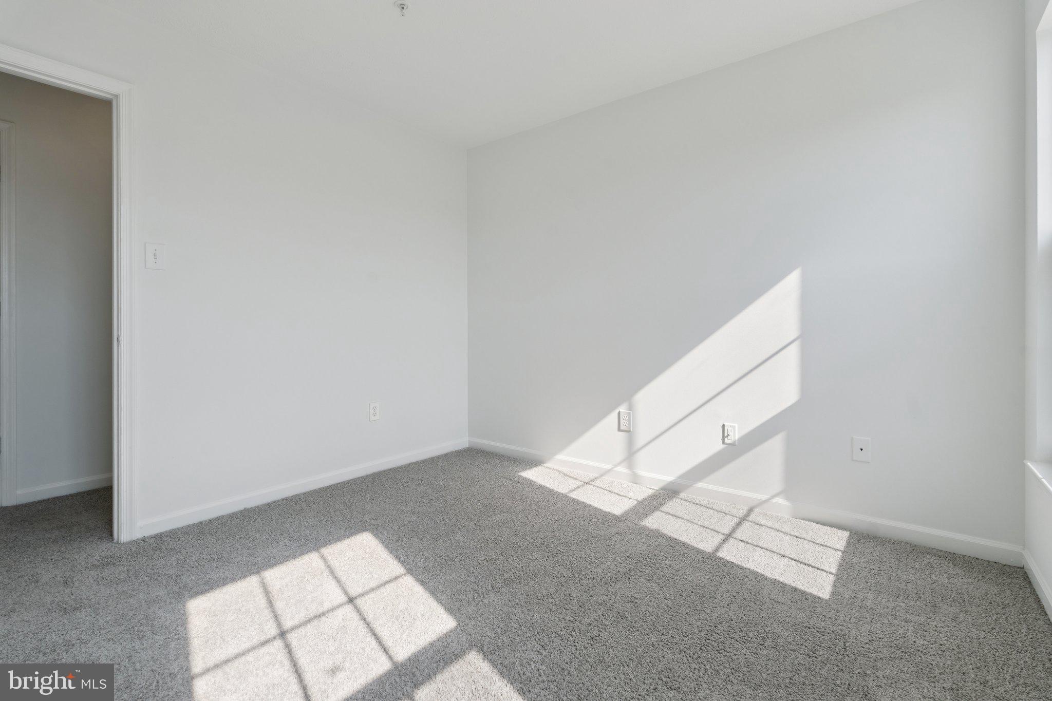 7655 Gladstone Road, Unit 5 Baltimore, MD 21244 - Photo 15 of 25 a view of an empty room and window