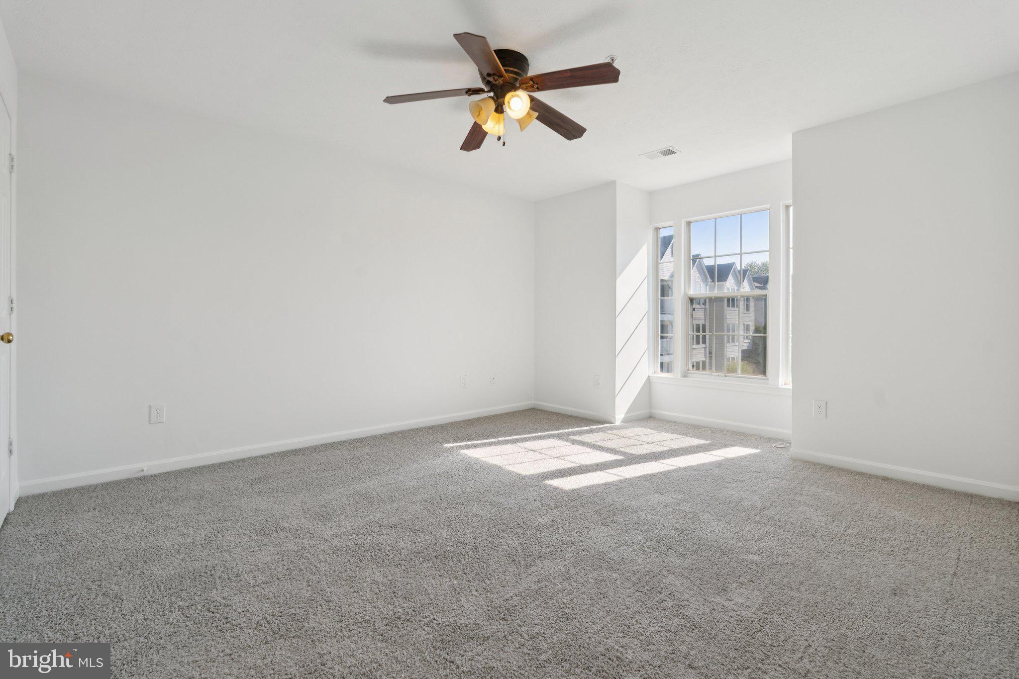 7655 Gladstone Road, Unit 5 Baltimore, MD 21244 - Photo 16 of 25 a view of a window in an empty room