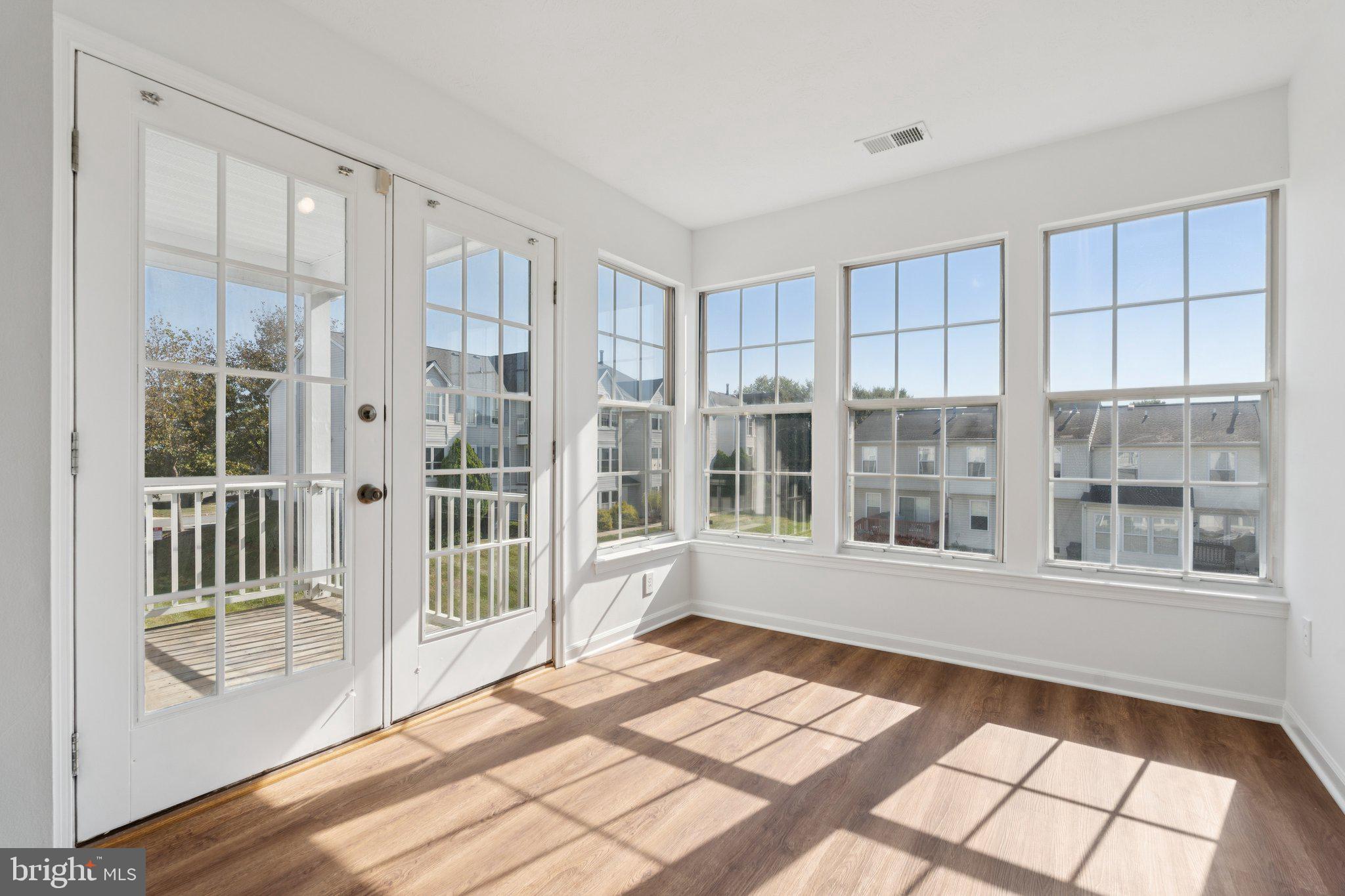 7655 Gladstone Road, Unit 5 Baltimore, MD 21244 - Photo 2 of 25 a view of an empty room with a window